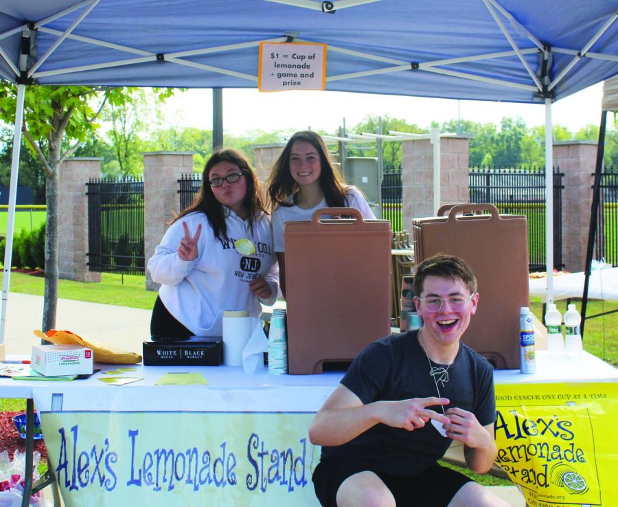 Combo students Nicole Steinberg, Ashlyn Oliver and Brandon McElhaney work at the Alex’s Lemonade stand at Warrior Fest to raise money for pediatric cancer research. 