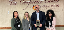 Dr. Brian Blaum, Dr. Nicole Cosentino, Mrs. Beth Pavinich and Mrs. Mercy Ross traveled to Central Penn College to receive the Friends of FCS award.
