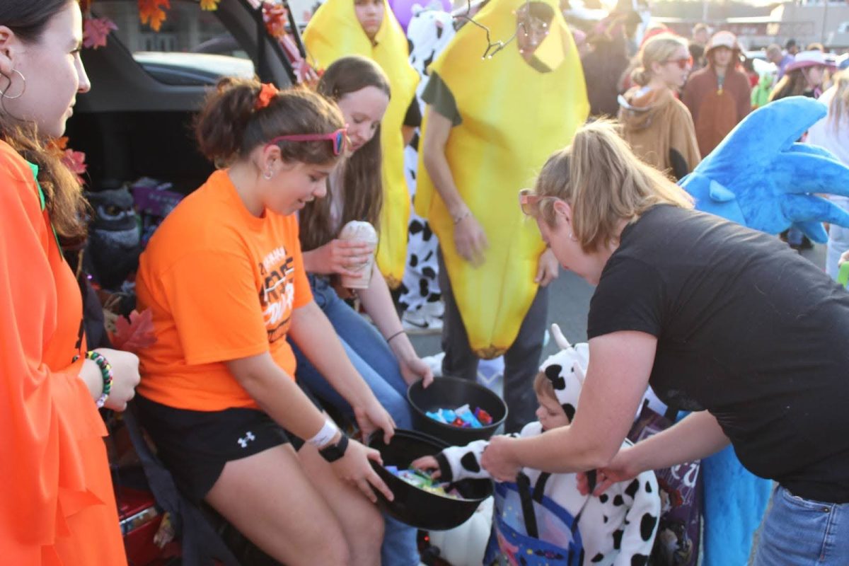 Members of Student Council offer candy and games to the youth participating in the trunk or treat event.
