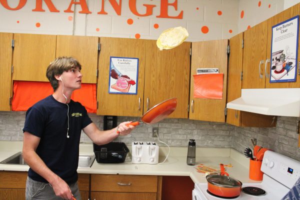 Senior Dean Finelli flipped the quesadilla as part of the Day of the Dead celebration.
