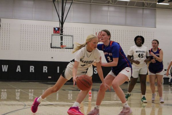 Junior Krystina Orby dribbles to the net.