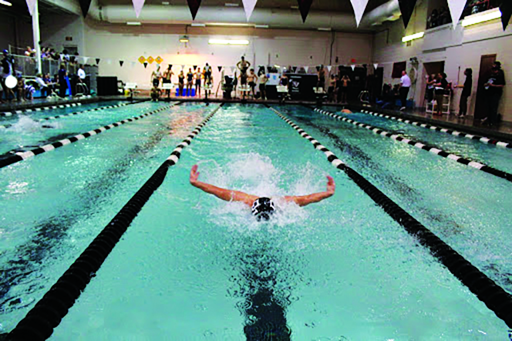 Senior Shane Naturale swims the butterfly to secure the win in the medley relay against Abington.
