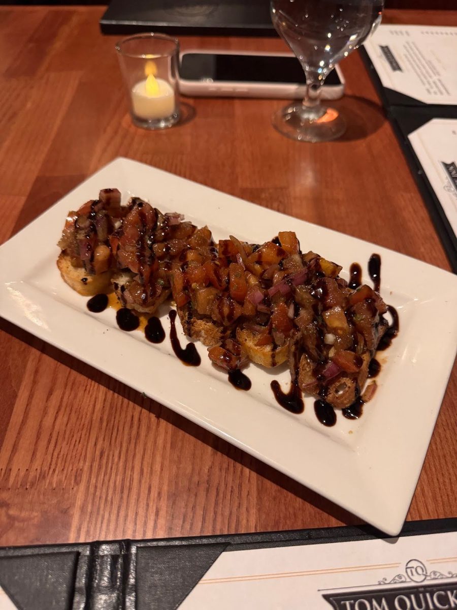 The fresh bruschetta served on garlic crostini appetizer was bursting with flavor.
