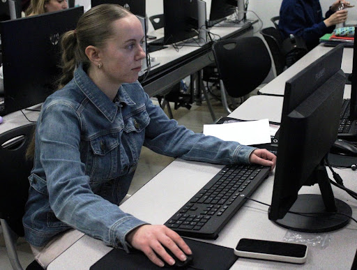 Senior Julia Boronow works on a business project during class.